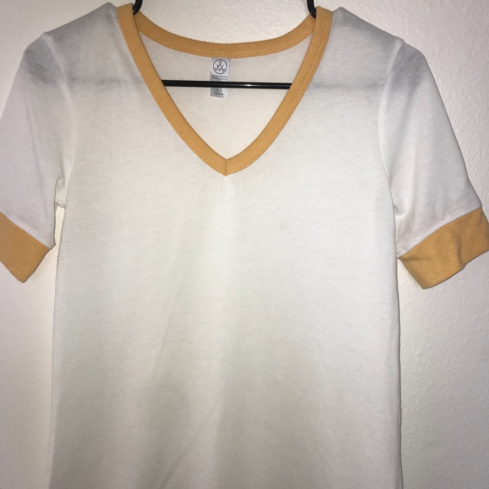 White and mustard yellow v-neck